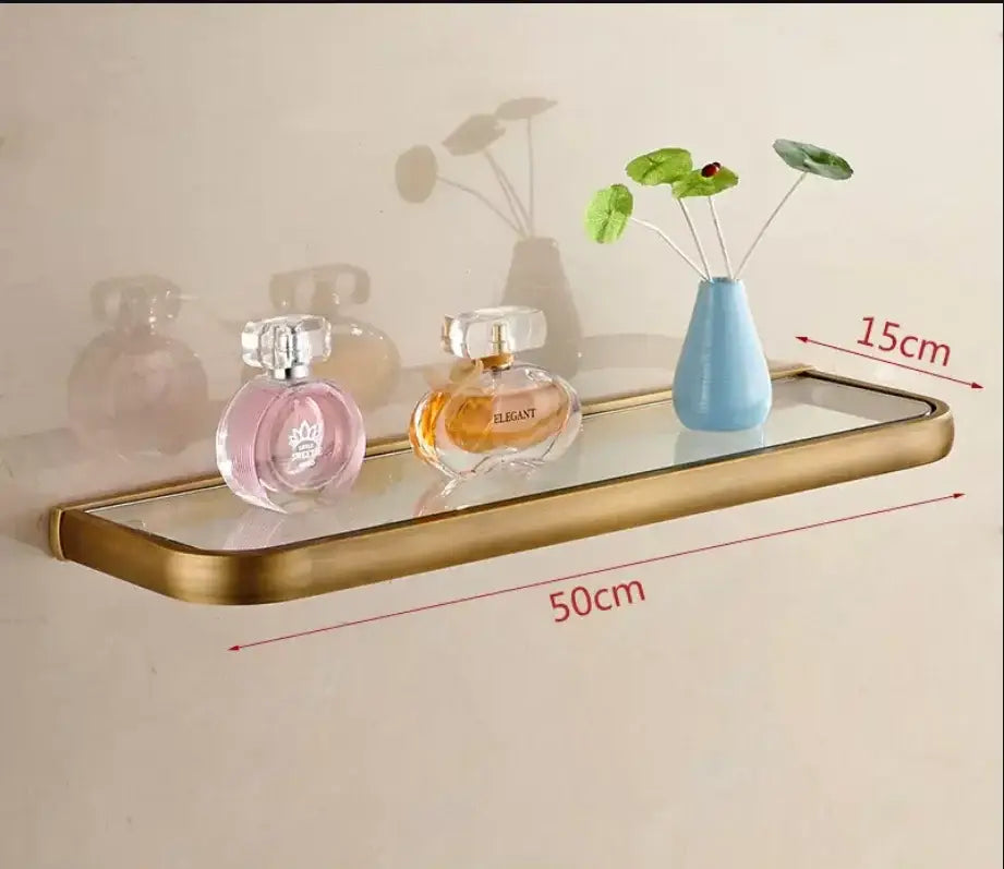 Gold-toned metal-framed glass shelf from decorbites antique bronze bathroom accessory set with sleek modern design