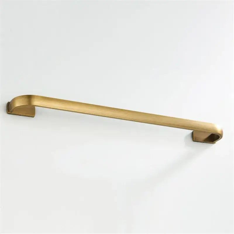 A sleek brushed brass towel rack from the DecorBites™ antique bronze bathroom accessory set with modern minimalist design