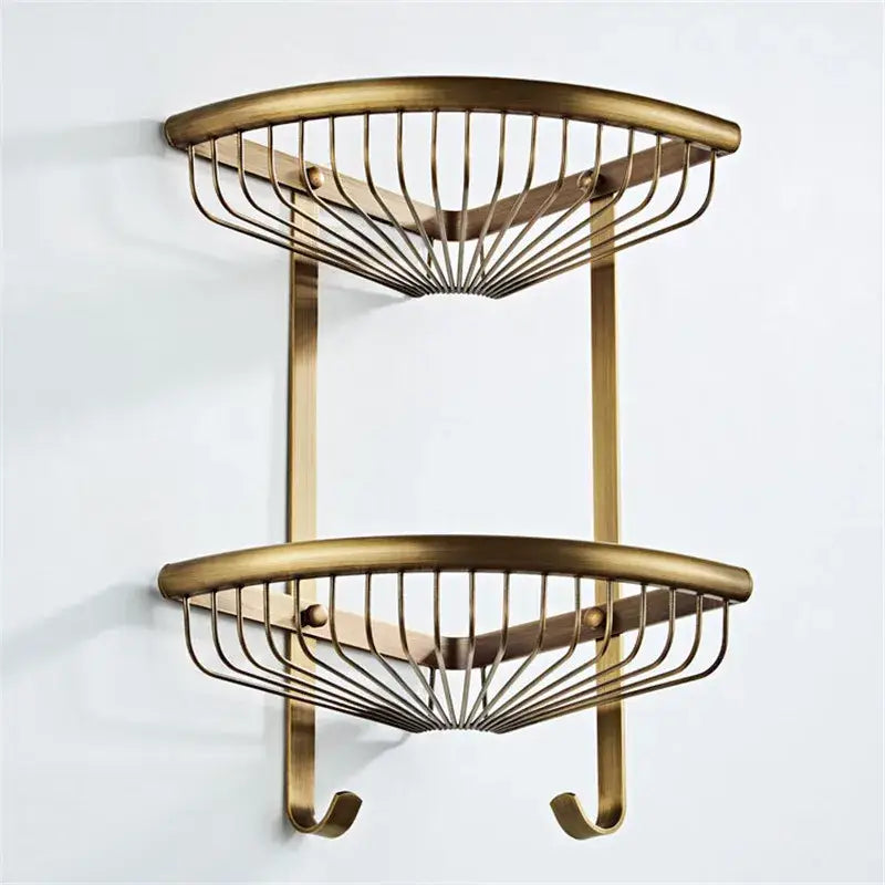 Brass double-tier corner shelf with curved wire mesh and hooks in antique bronze bathroom accessory set by decorbites