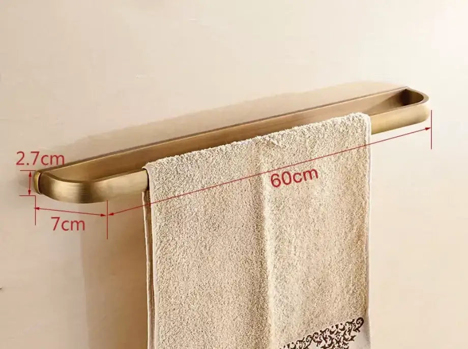 Decorbites antique bronze bathroom accessory set gold-toned towel rack with sleek curved design holding beige towel