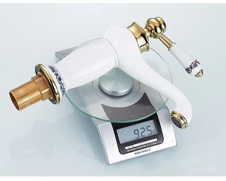 DecorBites antique bronze single handle bathroom faucet with white ceramic body and blue floral real shot details