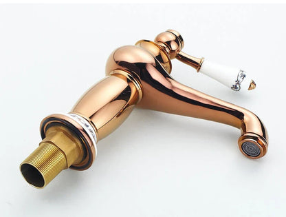 Rose gold finish DecorBites antique bronze single handle bathroom faucet with white ceramic handle and ornate silver design real shot details