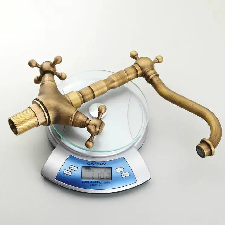 DecorBites™ antique bronze brass swivel basin faucet with ornate cross handles and curved spout for vintage style