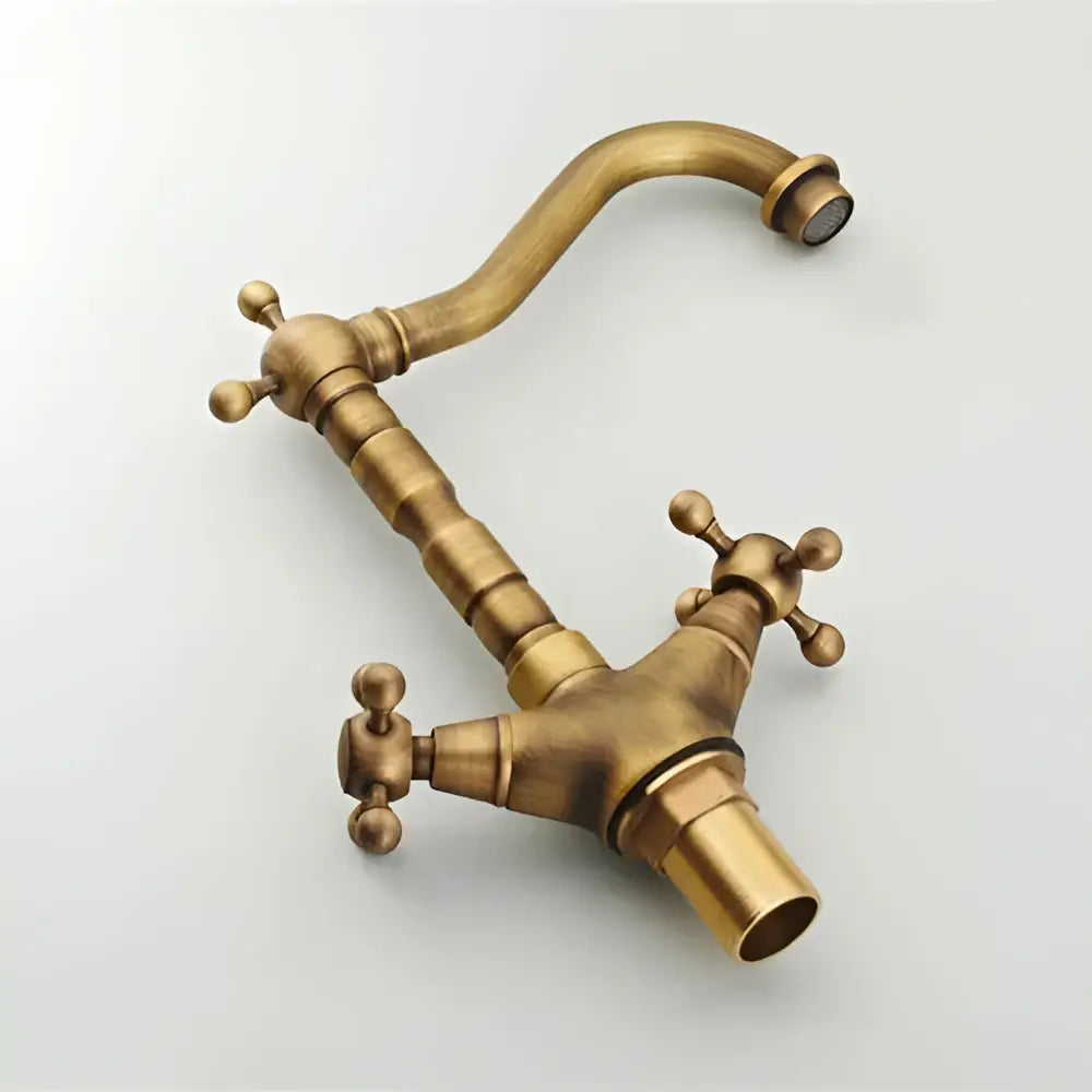 DecorBites antique bronze brass swivel basin faucet with two lever handles and a curved farmhouse-style spout