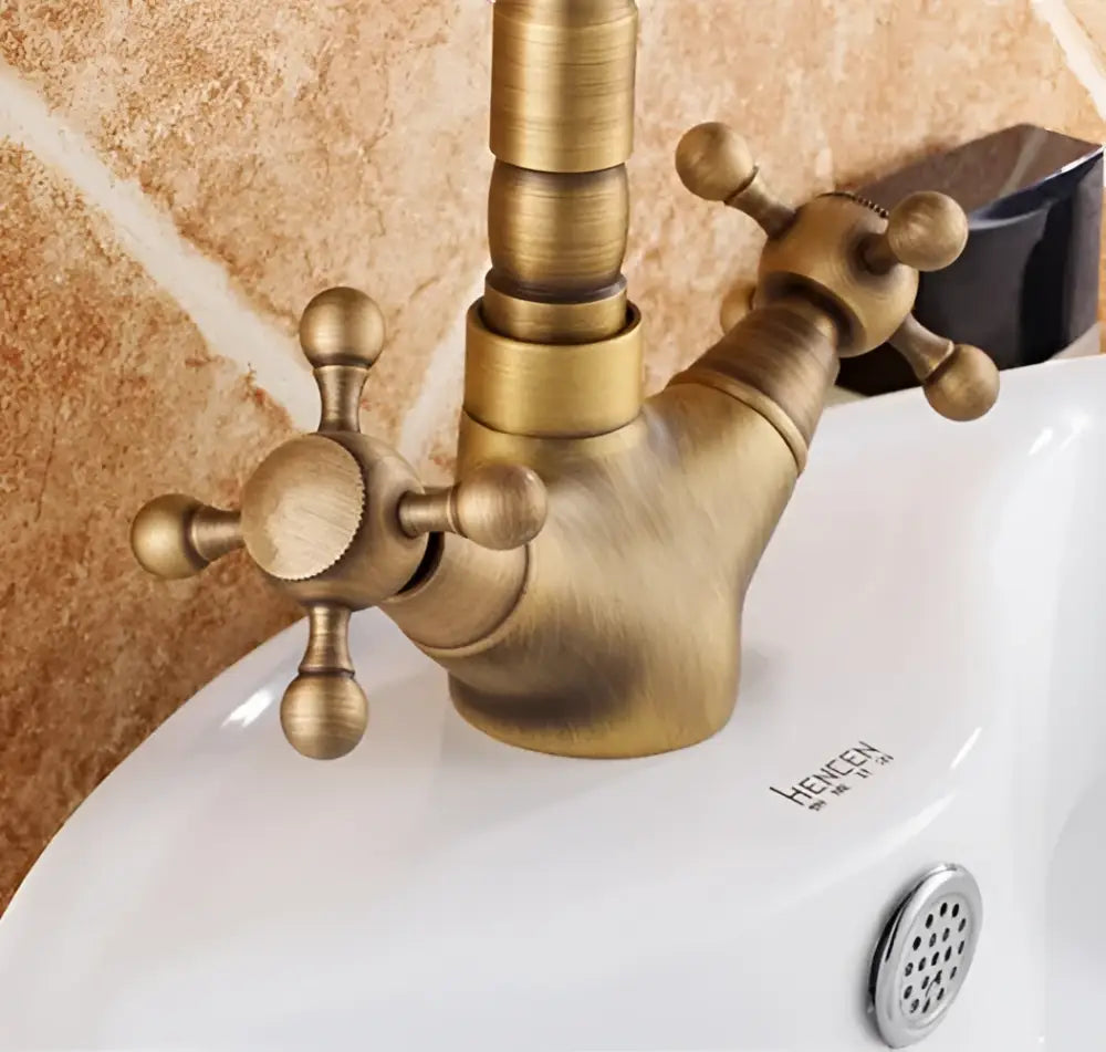 DecorBites™ antique bronze brass basin faucet with swivel spout and ornate cross lever handles for vintage bathroom use