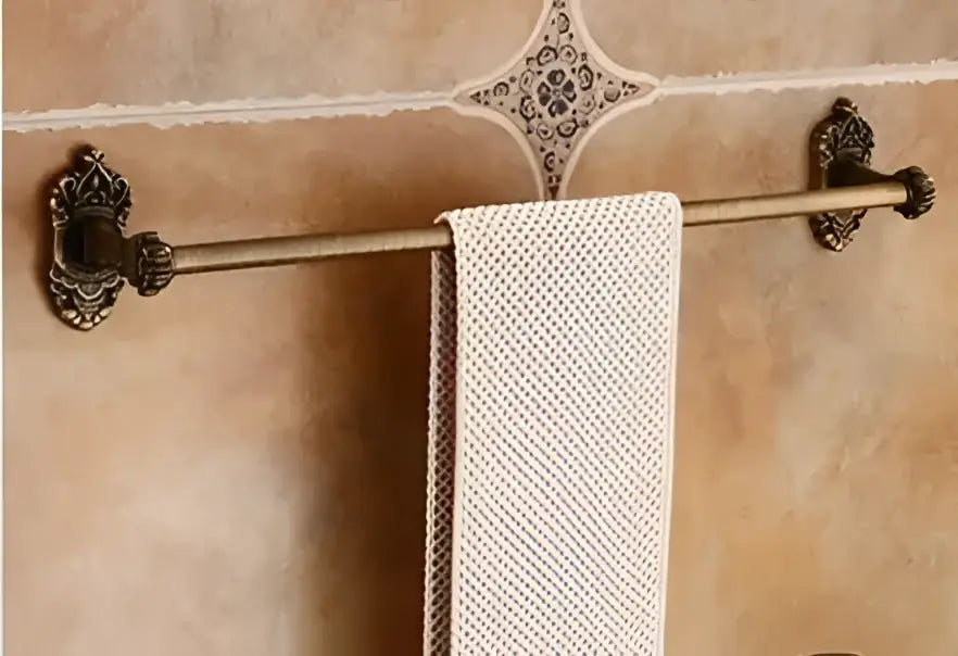 Decorbites™ antique bronze carved aluminum towel rack with ornate scrollwork holding textured off-white towel