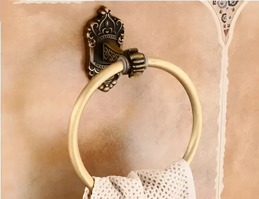 Antique bronze carved aluminum towel ring with ornate crown mount and beige towel from decorbites bathroom set