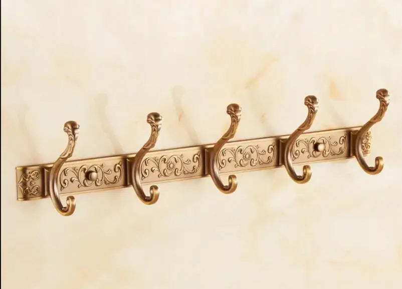 Antique bronze carved robe hook by decorbites with ornate floral engraving and curved hooks for bathroom or kitchen