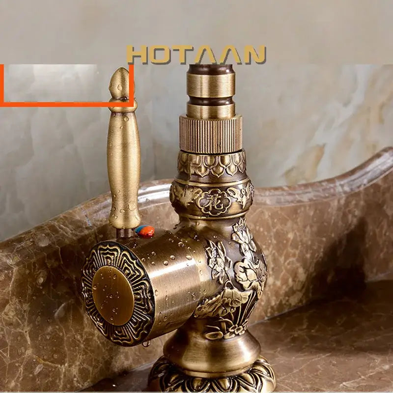 Decorbites antique bronze kitchen basin faucet with intricate floral bronze carving and decorative knob handle