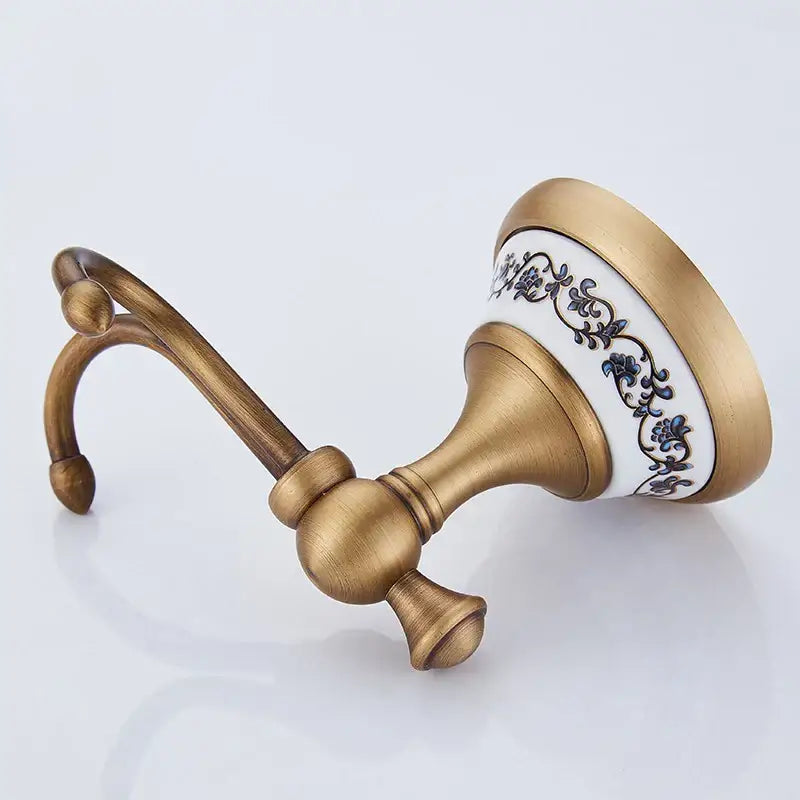 DecorBites™ antique bronze ceramic robe hook with white ceramic head and blue floral design for bathroom use