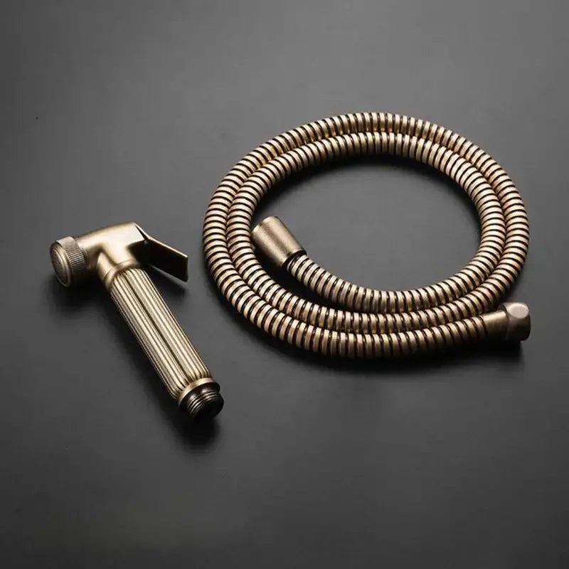 Decorbites antique bronze douche bidet sprayer set with brass-colored ribbed shower nozzle and flexible hose