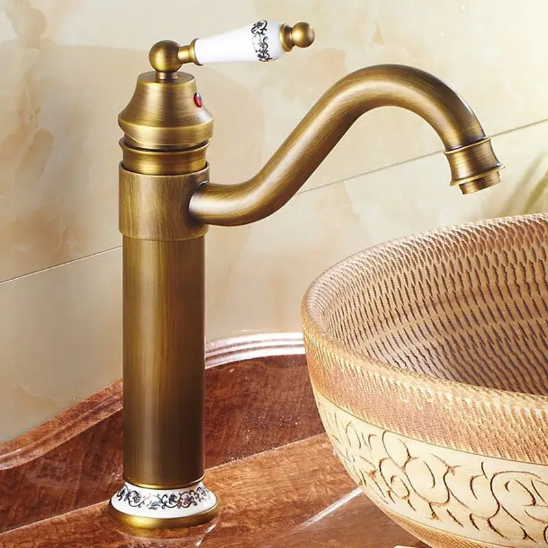 Decorbites antique bronze finish bathroom sink faucet with single white ceramic handle and black floral engraving