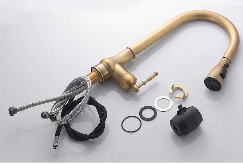 DecorBites antique bronze kitchen faucet with curved spout and pull-down spray head in antique brass finish