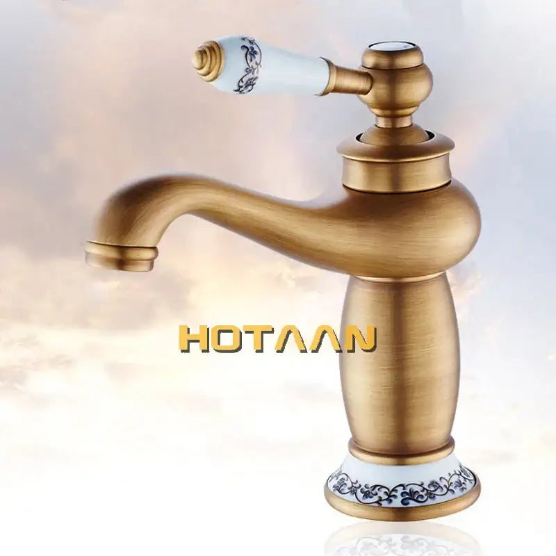 DecorBites™ antique bronze single handle basin faucet with white ceramic handle and blue floral pattern base