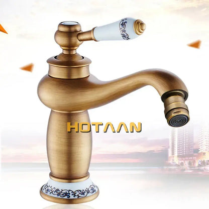 DecorBites™ antique bronze single handle basin faucet with white ceramic handle and blue floral base pattern