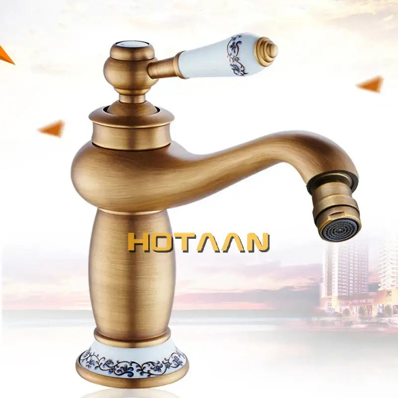 DecorBites™ antique bronze single handle basin faucet with white ceramic handle and blue floral base pattern