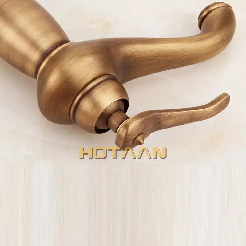 DecorBites antique bronze tall basin faucet in solid copper with an ornate curved spout and single-handle design