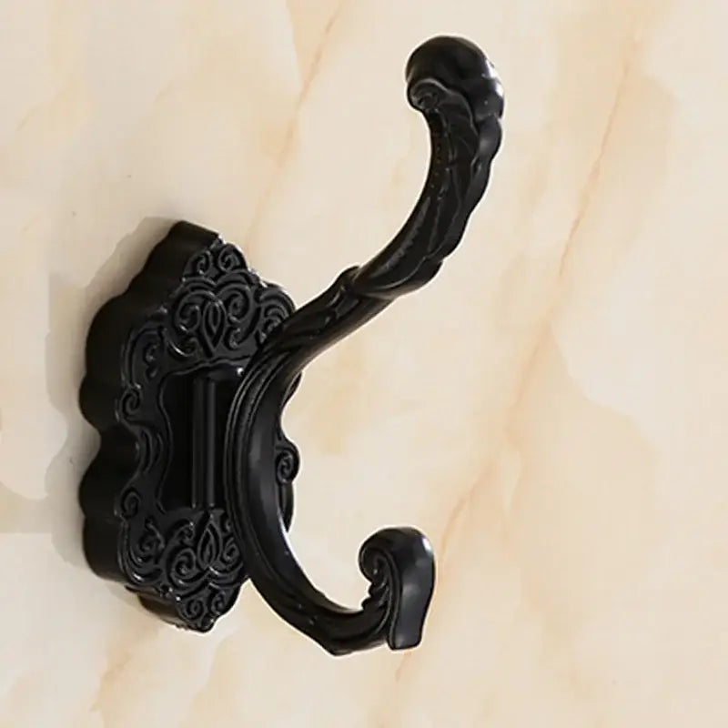 DecorBites™ antique bronze wall hooks made of black ornate metal with intricate scrollwork for hanging clothes towels and robes