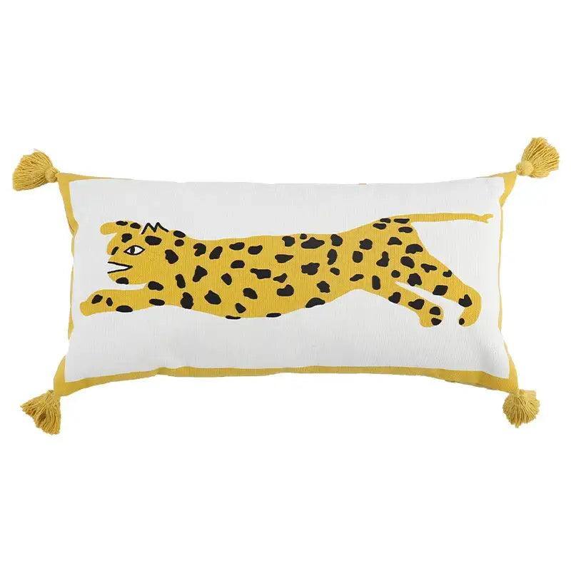 White rectangular pillow cover with antique brown tiger print featuring yellow leopard design and mustard-yellow tassels