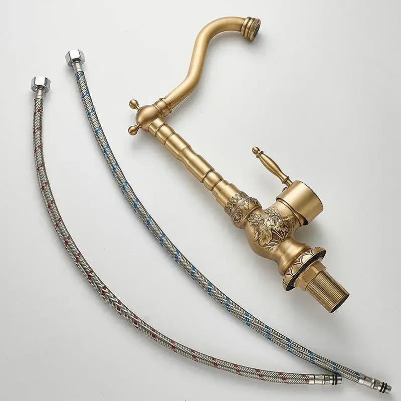 DecorBites antique carved brass bathroom sink faucet with ornate floral detailing and flexible braided hoses