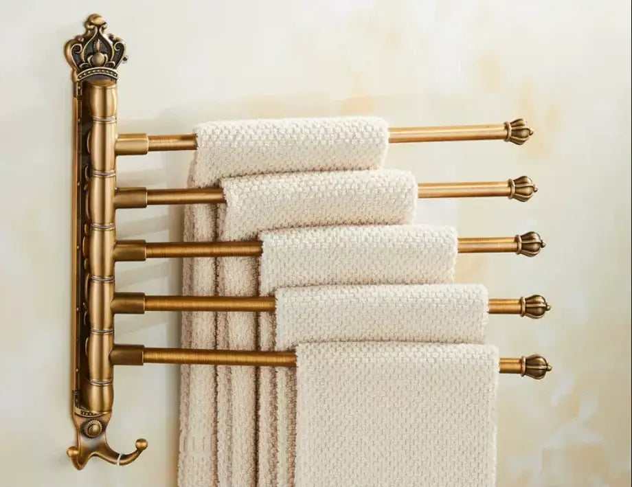 DecorBites™ antique carved swivel brass towel rack with ornate crown top holds cream textured towels in bathroom