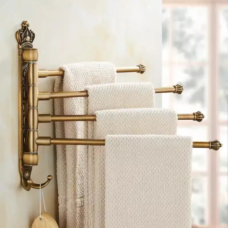 Antique brass DecorBites™ antique carved swivel multi-tiered towel rack with ornate crown and decorative finials