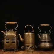 Three antique brass warm wine pots with wooden handles and intricate engraved designs from decorbites™ antique collection