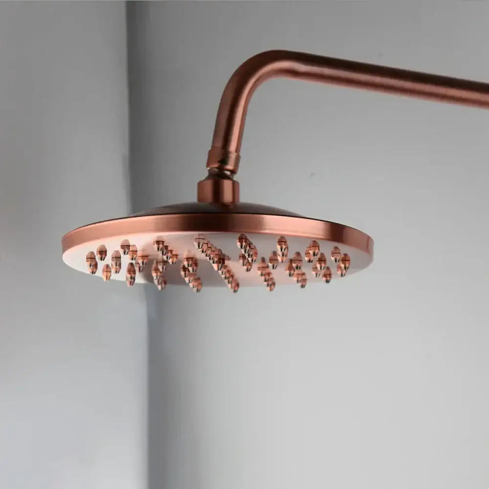Decorbites antique copper shower set featuring a copper-finished round showerhead with multiple nozzles for rainfall and hand shower use
