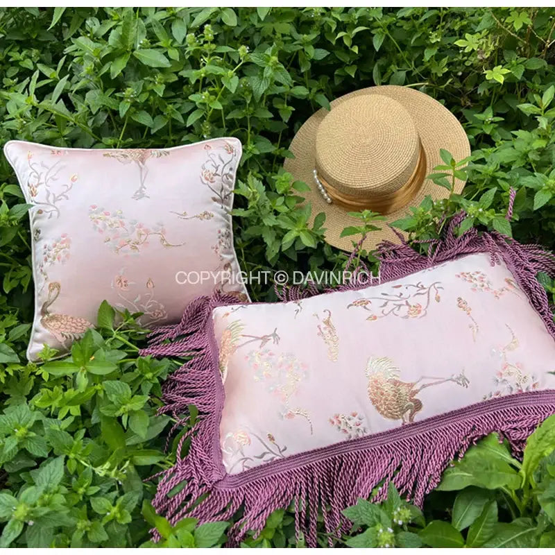 DecorBites antique crane floral jacquard pillow case in pink with purple fringe and peacock motifs in gold stitch