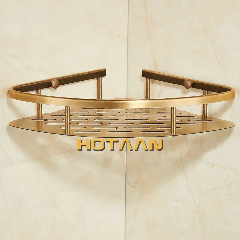 Brass-colored antique finish aluminum shower basket with perforated design and rounded edges for bathroom storage