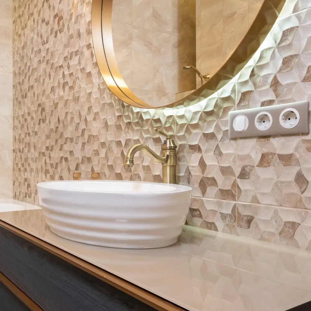 White ceramic oval sink with subtle ridges paired with DecorBites antique finish brass basin faucet for bathroom vanity