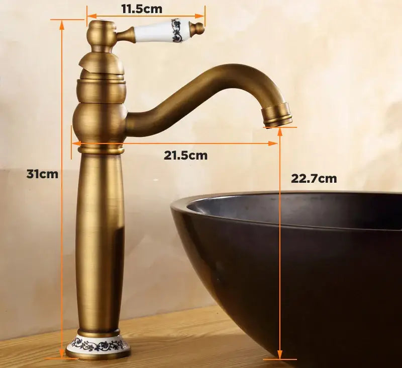 DecorBites™ antique finish brass basin faucet with white ceramic handle and black floral patterns for bathroom vanity