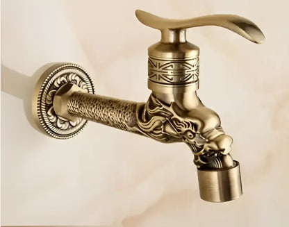 Antique brass decorbites garden bibcocks tap with ornate dragon head design and intricate engraved patterns for outdoor use