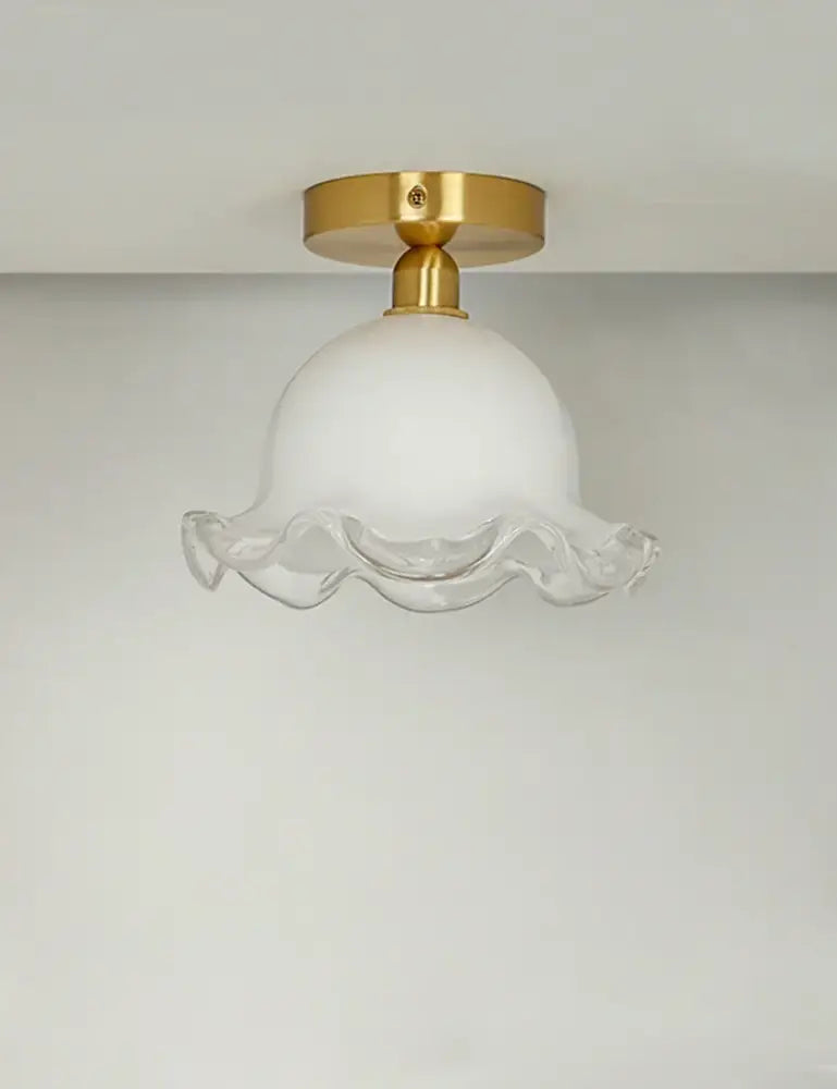 Decorbites antique glass ceiling light featuring a white frosted glass pendant with gold brass base and ruffled edge