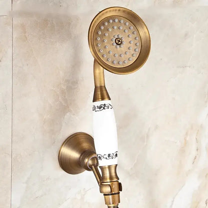 Decorbites™ antique gold handheld shower head with antique brass finish and white ceramic handle with black patterns
