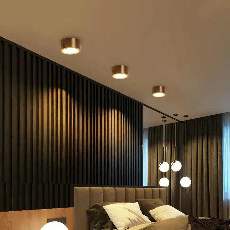 Three sleek cylindrical brass decorbites antique gold led ceiling downlights with warm glow for retro home lighting