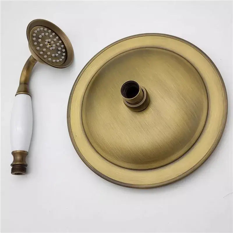 DecorBites antique brass shower head set with white ceramic handle features a shower head holder and handheld sprayer