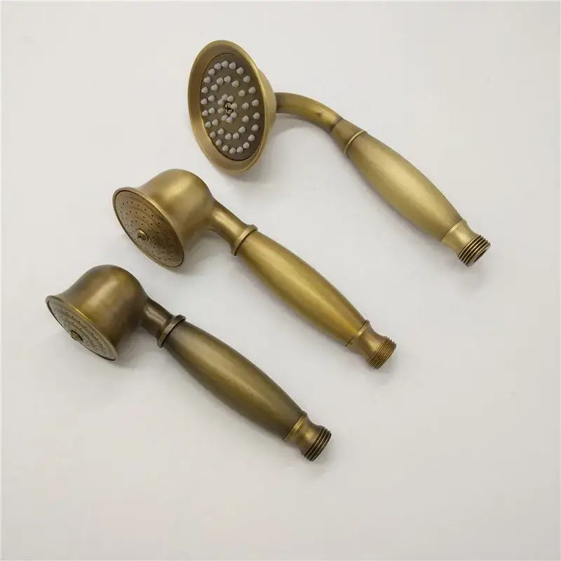 Three brass-finished shower heads with varied nozzles and elongated handles for decorbites™ antique shower head holder