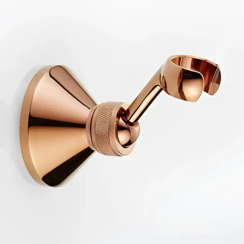 Rose gold metallic wall-mounted towel rack with sleek modern design and textured joint for DecorBites antique handheld shower setup