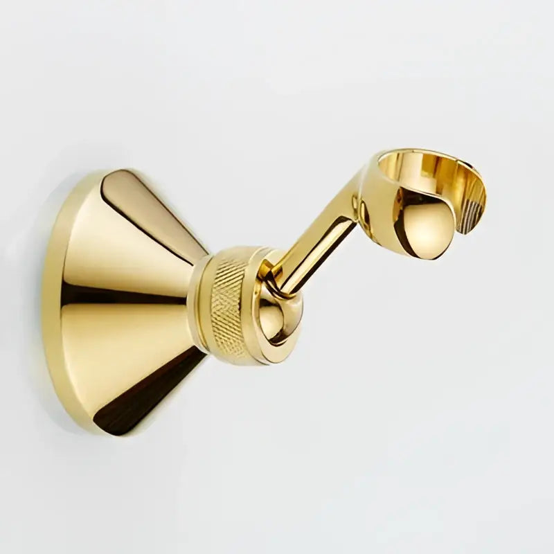 Gold-colored brass towel rack with polished finish complementing decorbites antique handheld shower head set