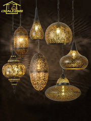 Golden intricately pierced metal pendant light with ornate patterns and warm glowing interiors decorbites antique hollow carving