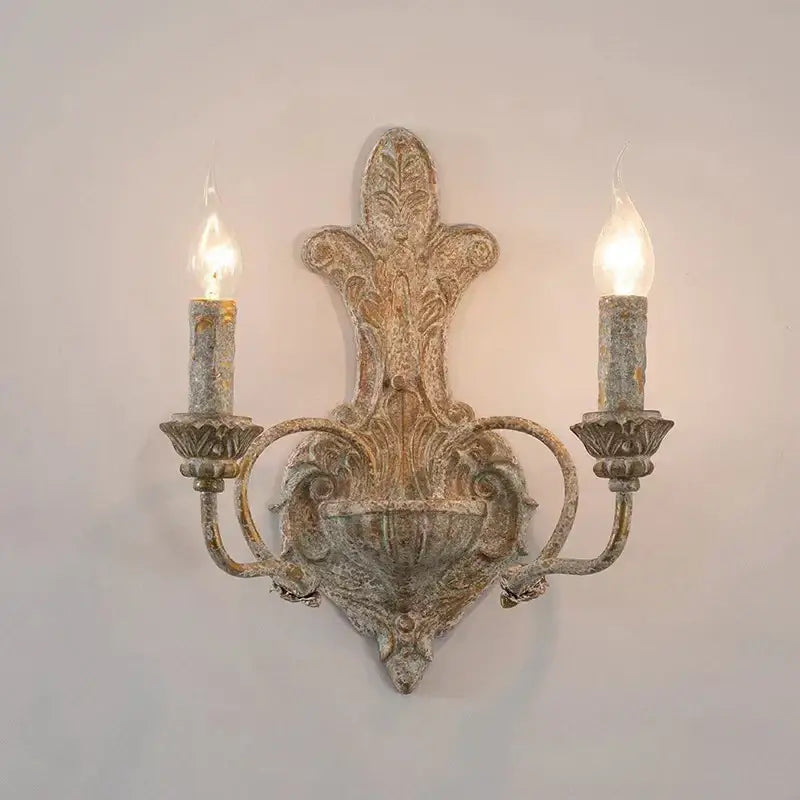 DecorBites antique iron double wall lamp with ornate distressed finish and candle-shaped bulbs for bedroom and corridor lighting