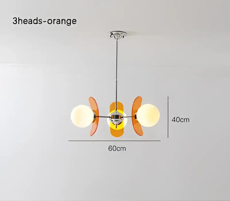 Orange three-head pendant light with frosted glass globes and metallic accents by DecorBites antique style chandelier