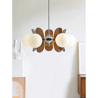Decorbites antique style chandelier with chrome fixture, frosted glass globes, and amber leaf panels for warm minimalist decor
