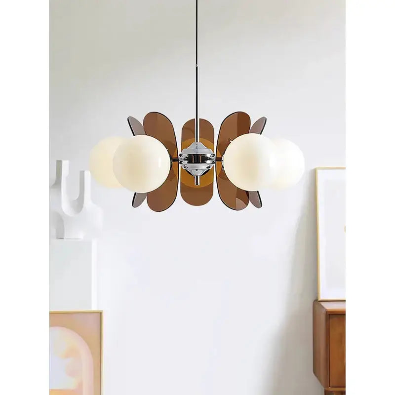 Decorbites antique style chandelier with chrome fixture, frosted glass globes, and amber leaf panels for warm minimalist decor