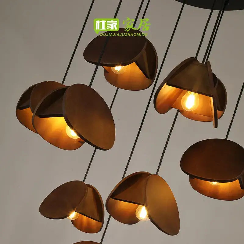 Modern bronze-toned metal pendant light with sculptural petal design from decorbites antique style solid wood collection