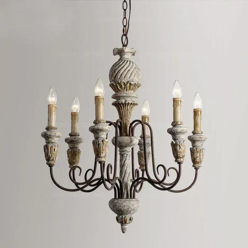 Decorbites antique white wooden chandelier with distressed gray and gold finish and ornate carved details