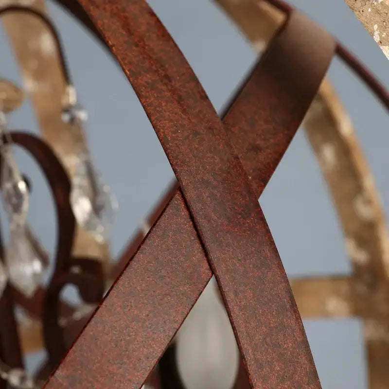 Rusty brown metal bands form an intricate pattern on decorbites antique wood globe chandelier for versatile room use