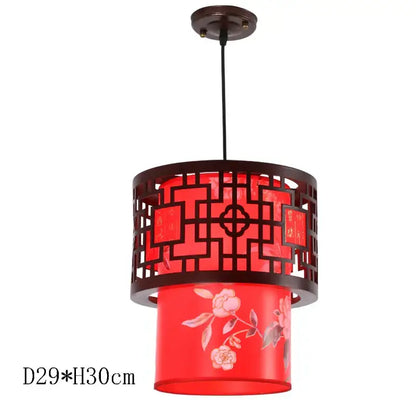 Red cylindrical pendant light with dark brown metal frame and floral glass shade from decorbites antique wood pendant lights