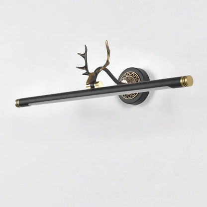 Black and gold decorbites antler deer-head mirror light sconce with sleek elongated bar for bedroom and bathroom use